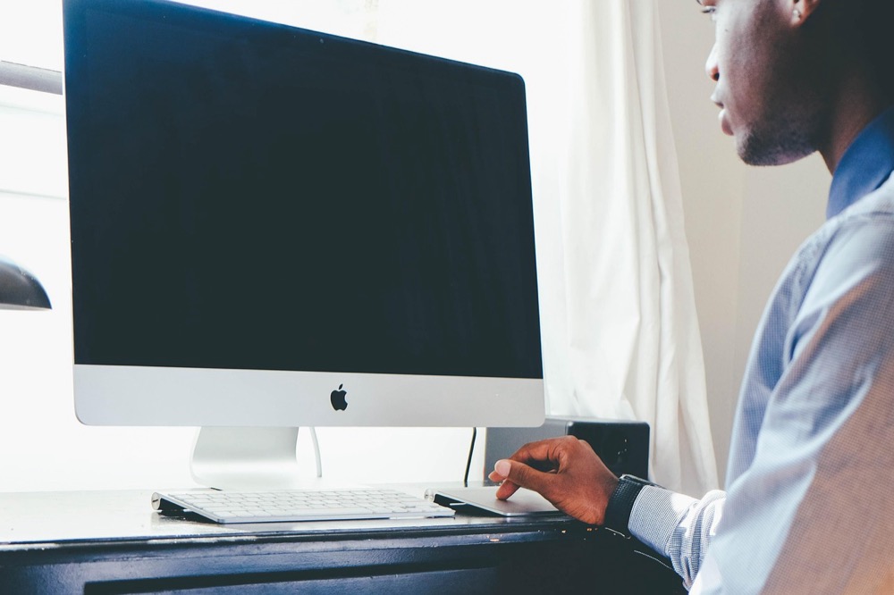 A person working through logic problems on a laptop - free logical reasoning practice